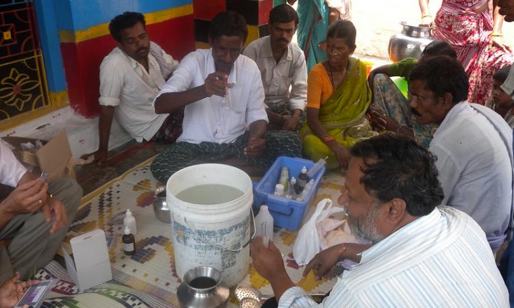 Residents of a village testing their water (Image Source: Arghyam)