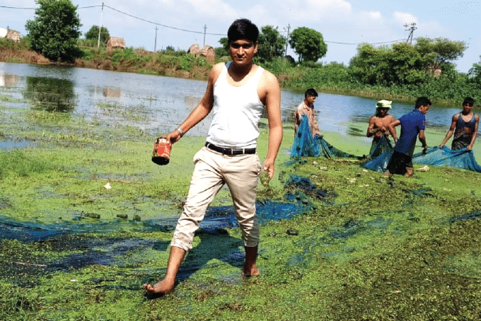 Ramveer working hard to clean-up a lake (Source: Say Earth)