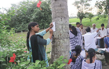 Schoolchildren in Sundarbans jot down what village elders say about lost and disappearing plants and animals