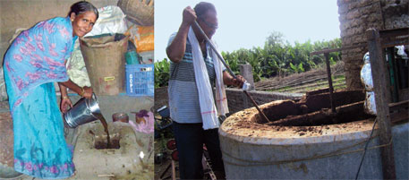 Sindhutai Tayade adds cow dung slurry to her plant through the feeder; Vijay Ingle stirs the slurry in biogas digester tank