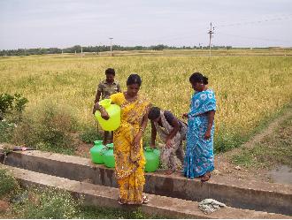 Farmers taking water from the borewell