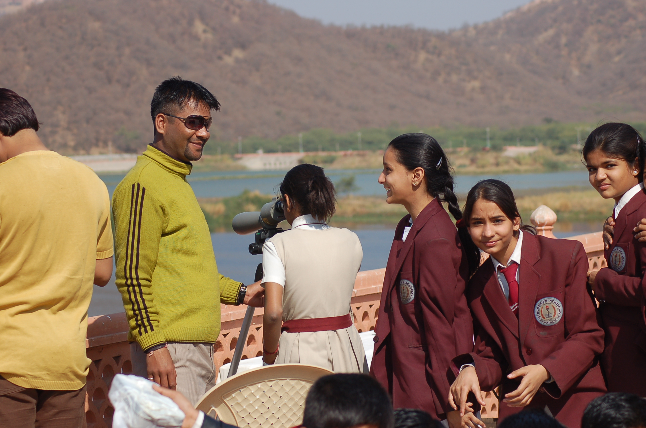 Govind Yadav giving birding tips to students at the Fair