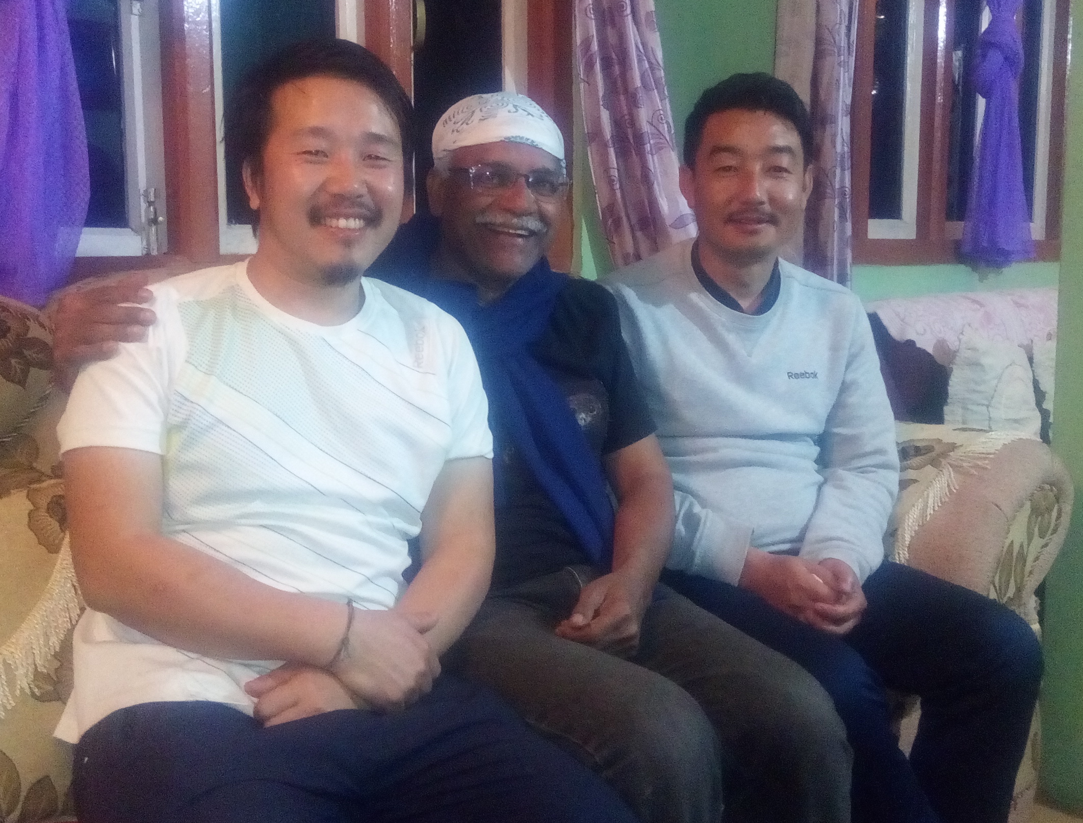 Gyaatso (left) and Ugen (right) with author K. J. Joy at Ugen's home.
