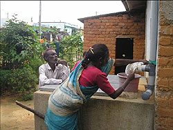 Woman placing a clean cloth filter on the pipe