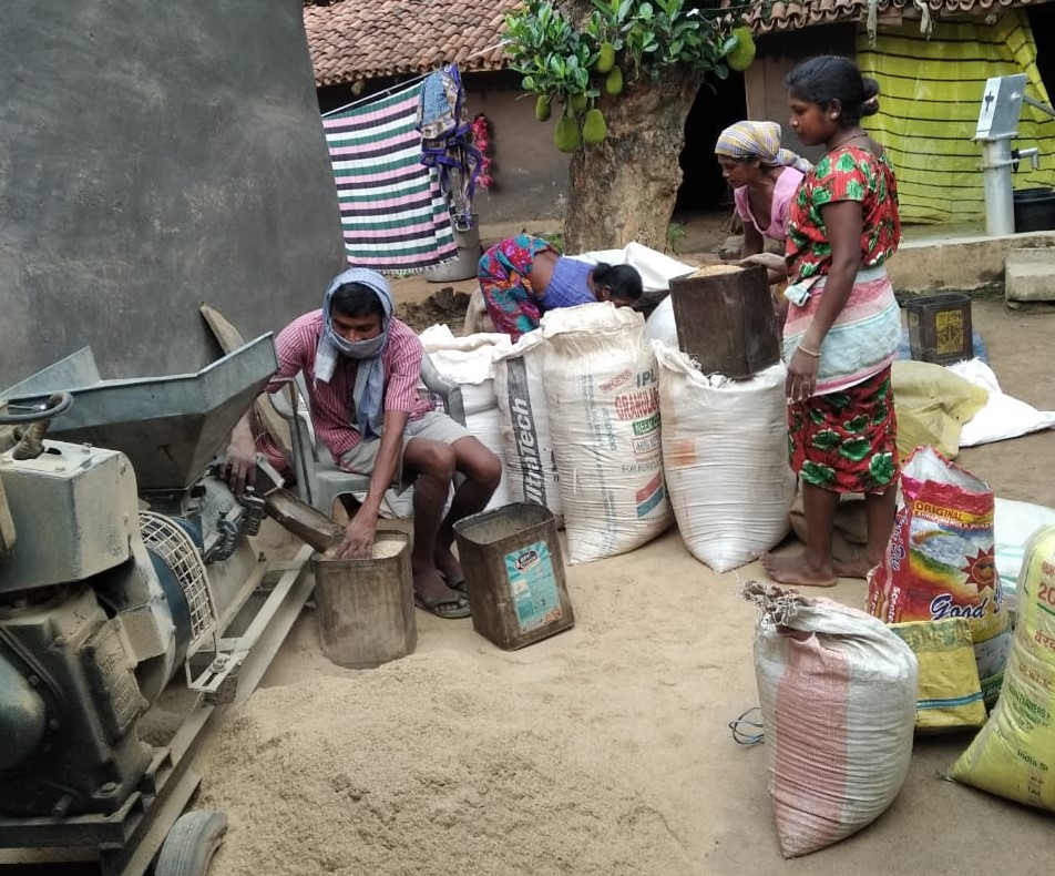 Dehusking rice in the village (Image Source: WOTR)