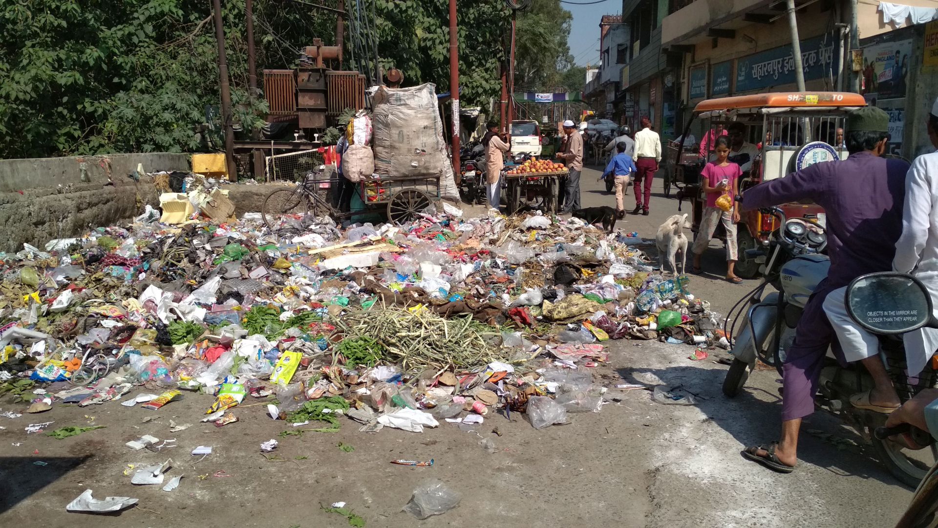 Heaps of garbage lie strewn in corners, lanes and markets along the river Paondhoi today. (Image: India Water Portal)