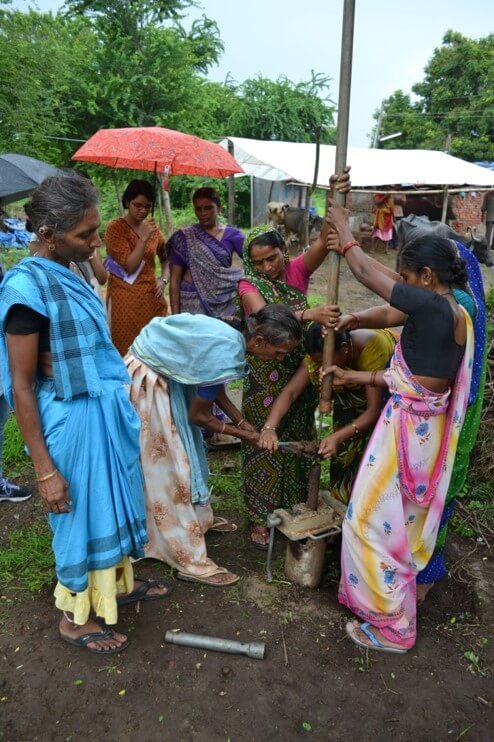 Sari-clad women fix hand pumps in Sabarkantha district in north Gujarat. 