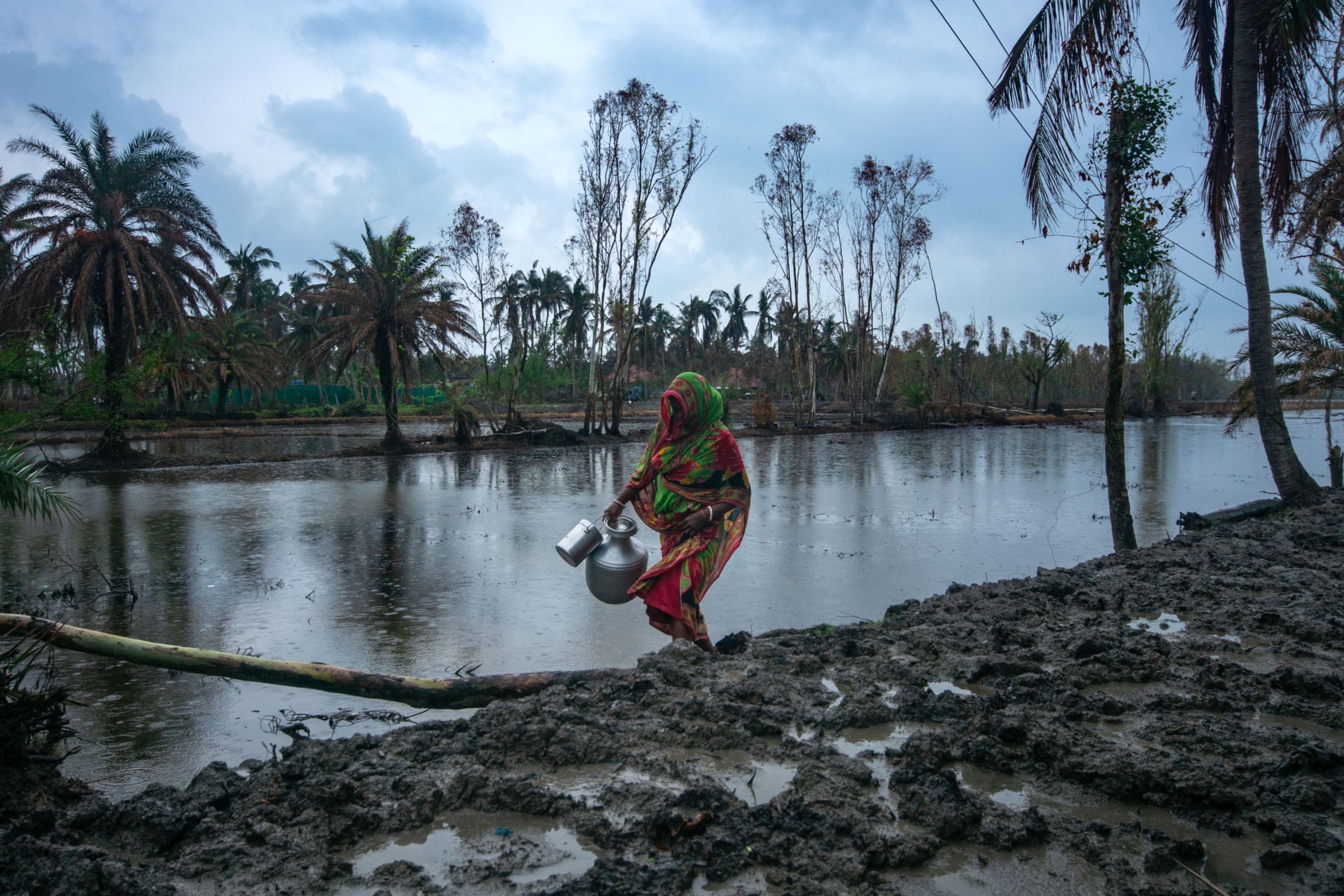 The road that connects Mamoni Giri’s house to the tube well has been covered with dripping mud after Amphan. (Image: WaterAid, Subhrajit Sen)  