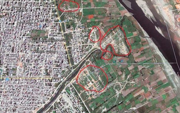 The Yamuna floodplains have many constructions throughout its stretch in Delhi. This has dangerously reduced the width of the river at places to a narrow strip. A satellite image of 2015 shows far too many new constructions (encircled) in the active floodplain of Yamuna in violation of the NGT orders of January 2015. (Image courtesy: India Today)