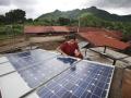 Woman barefoot solar technician (Image: Abbie Trayler-Smith/Panos Pictures/Department for International Development; CC BY-NC-ND 2.0 DEED)