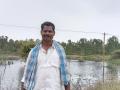 Narasimhappa, a village resident, positioned against the backdrop of the Agrahara tank (Image: FES)