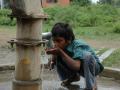 Child drinking water from handpump in Guna, Madhya Pradesh (Image: Anil Gulati, India Water Portal Flickr)