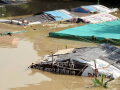 नई दिल्ली, 28 सितंबर, 2022 में यमुना नदी खतरे के निशान से ऊपर बह रही है, निचले इलाके में जलमग्न झोंपड़ी,फोटो साभार-(पीटीआई)