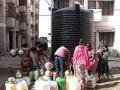 Residents struggle for a pot of drinking water at Bhuri Tekri, Indore.