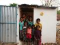 Children pose outside a toilet in Sanarpudur village, Namakkal.