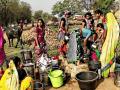 Collecting water, a daily backbreaking task of women. (Image Source: India Water Portal)