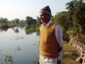 Farmer looks at the water conservation efforts