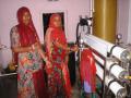 Villagers operate the solar-powered reverse osmosis desalination plant that provides safe drinking water to the community at Solawata.