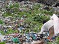 A ragpicker sorts through garbage