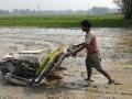 Gulam Mustafa with the rice planter. (Photo by Gurvinder Singh)