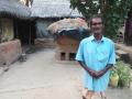 Renupada Bagdi in front of his thatched house. (Photo: Gurvinder Singh)