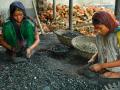 Two girls recycle metal from used batteries at a workshop in Dhaka, Bangladesh (Image: UNICEF/Naser Siddique)