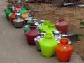 Water pots lined up for filling. (Source: McKay Savage, Wikimedia Commons)