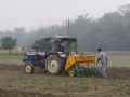 Zero tillage machine mounted on a tractor.