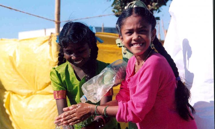 Girls learn the value of hand-washing (Image: Kristen Kelleher, USAID, Pixnio)