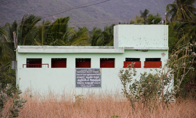 Due to the lack of water supply, this community toilet complex is left to rot in the village Sanarpudur (Image: IWP Flickr)