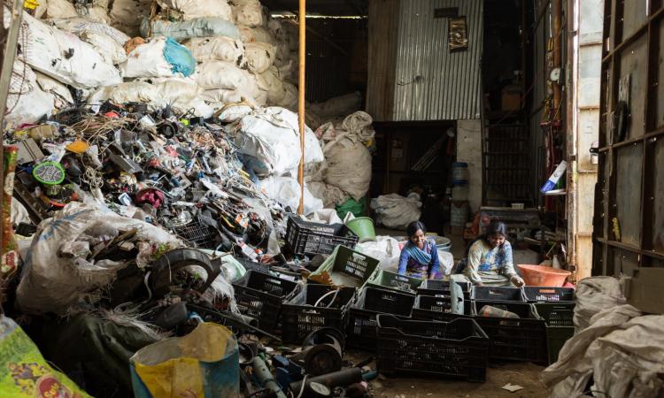 Waste pickers and sorters working hard to extract recyclable value from the waste we throw out (Image: Vinod Sebastian/ Saamuhika Shakti)