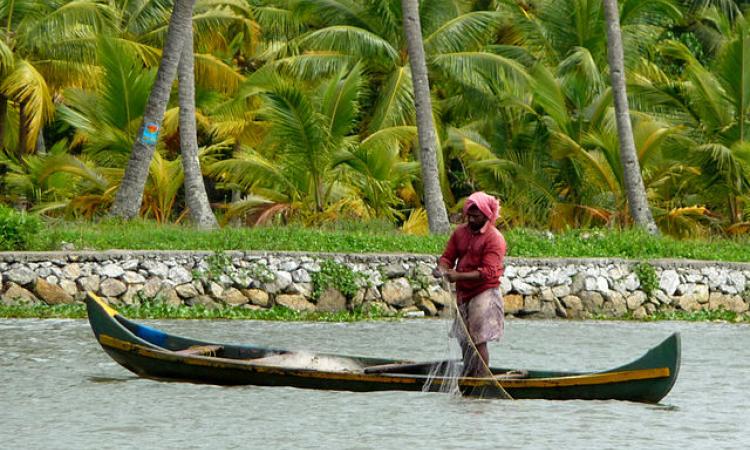 Fishing in an irrigation canal in Kerala (Image Source: Martin Pilkinton via Wikimedia Commons)
