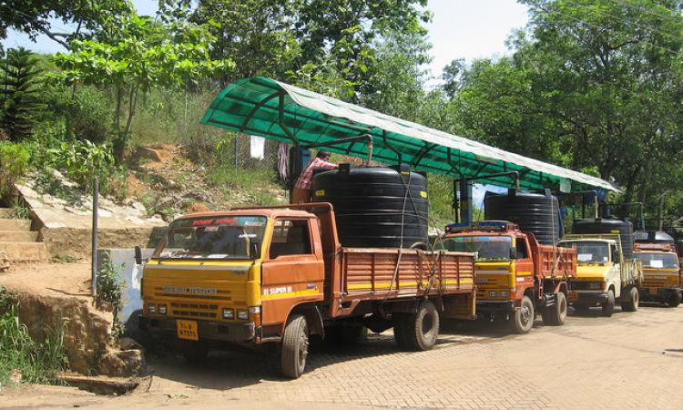 Water tankers fill in water (Source: IWP Flickr Photos)