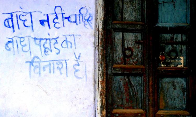 We don't want dams, dams destroy  mountains' reads a slogan painted on a wall in Uttarakhand (Image Source: GJ Lingaraj)