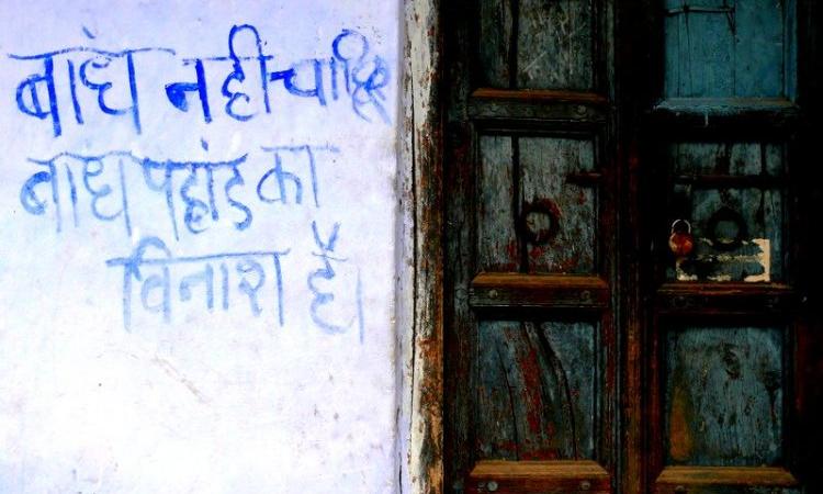 We don't want dams, dams destroy mountains,' reads a slogan painted on a wall in Uttarakhand (Image Source: GJ Lingaraj)