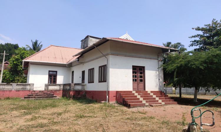 Rainwater is captured from the rooftop of the community hall and diverted to the sump before it is pumped into the open well. (Image by Authors)