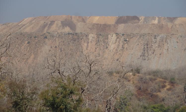 Piles of overburden (waste) dumped near the mine pits of Jhamarkotra