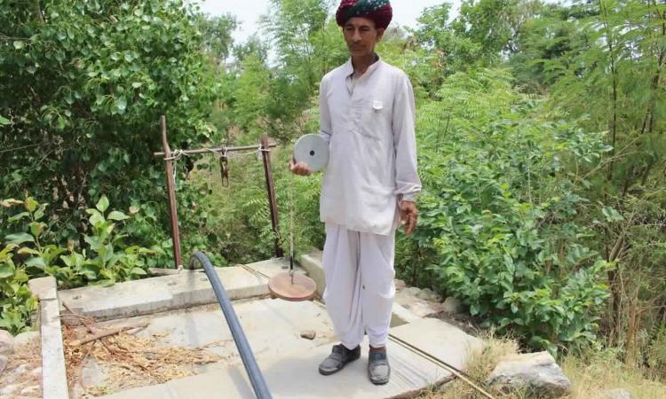 One of the Bhujal Jankaars measuring groundwater levels manually (Image: Basant Maheshwari)