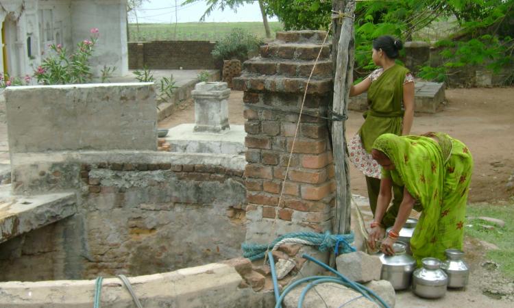 Women and girls spend a considerable amount of their time in fetching water. (Image: Romit Sen)