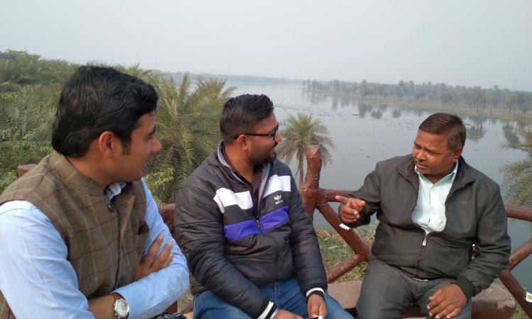 The forest department and local activists discuss the threats on Surajpur, an urban wetland encroached upon by private real estate as well as the government. (Image: India Water Portal)